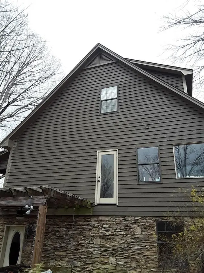Real exterior house painting dark siding by C&C Home Solutions LLC in Jefferson County AL