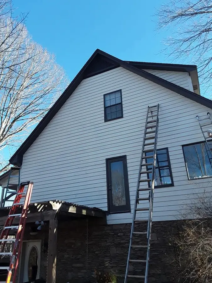 Real exterior house painting white siding by C&C Home Solutions LLC in Jefferson County AL